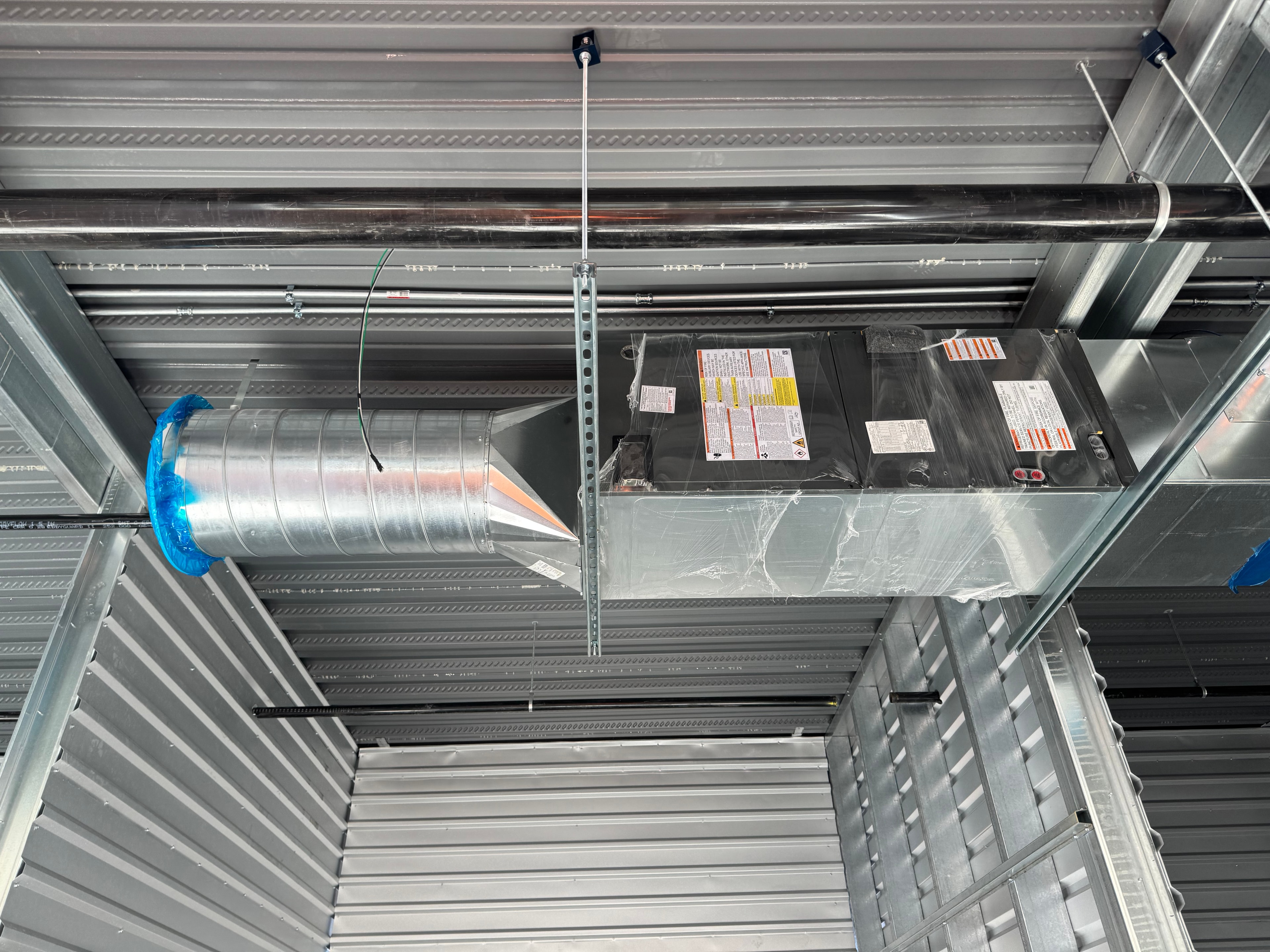 Fan coil unit with conical round supply connection