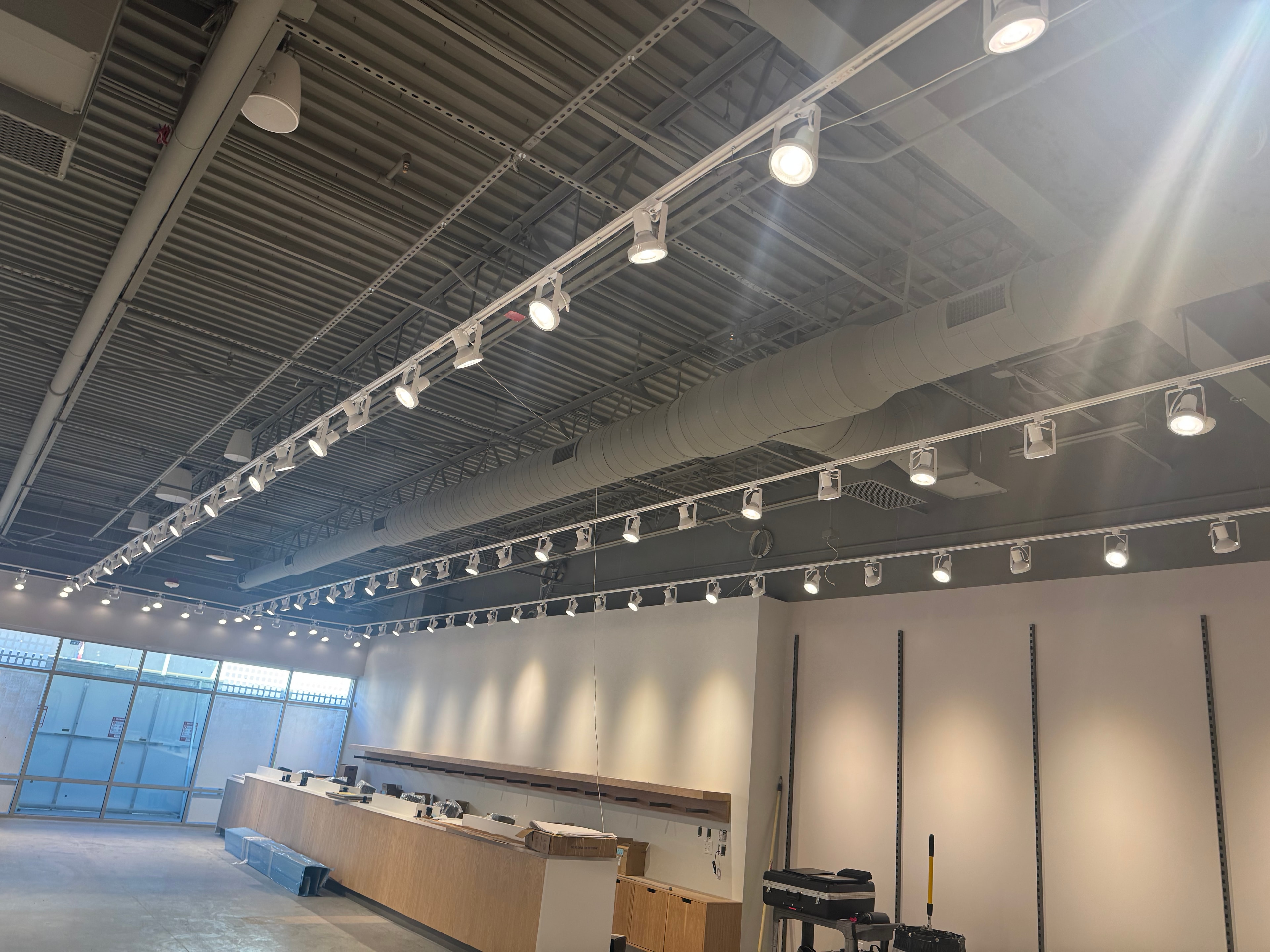 Finished ductwork with track lighting grid