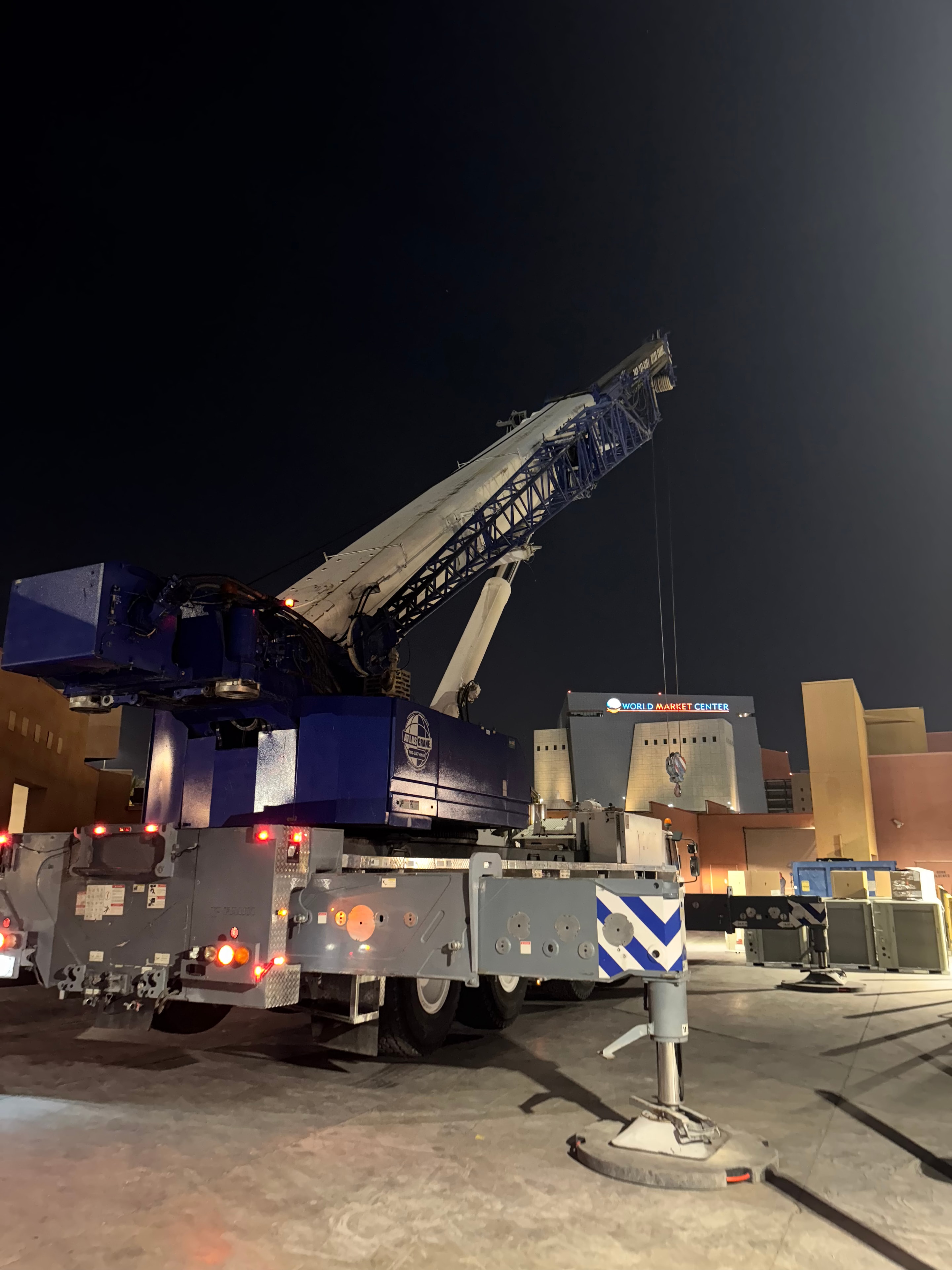 Nighttime crane operation — Fashion Show Mall corridor