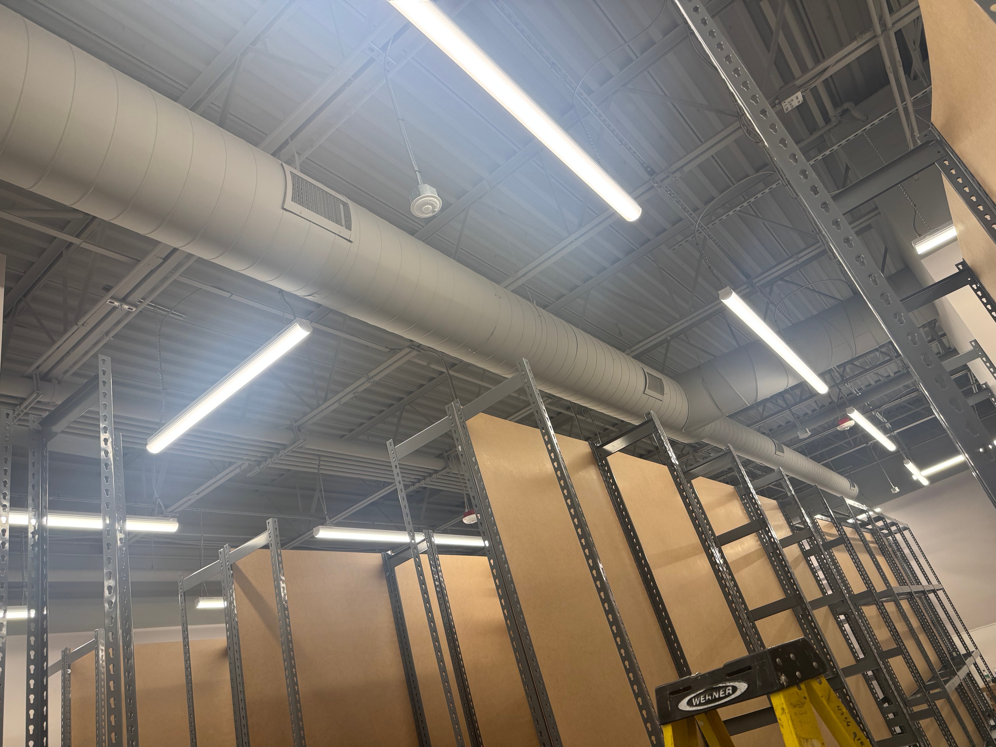 Back-of-house corridor — round duct run