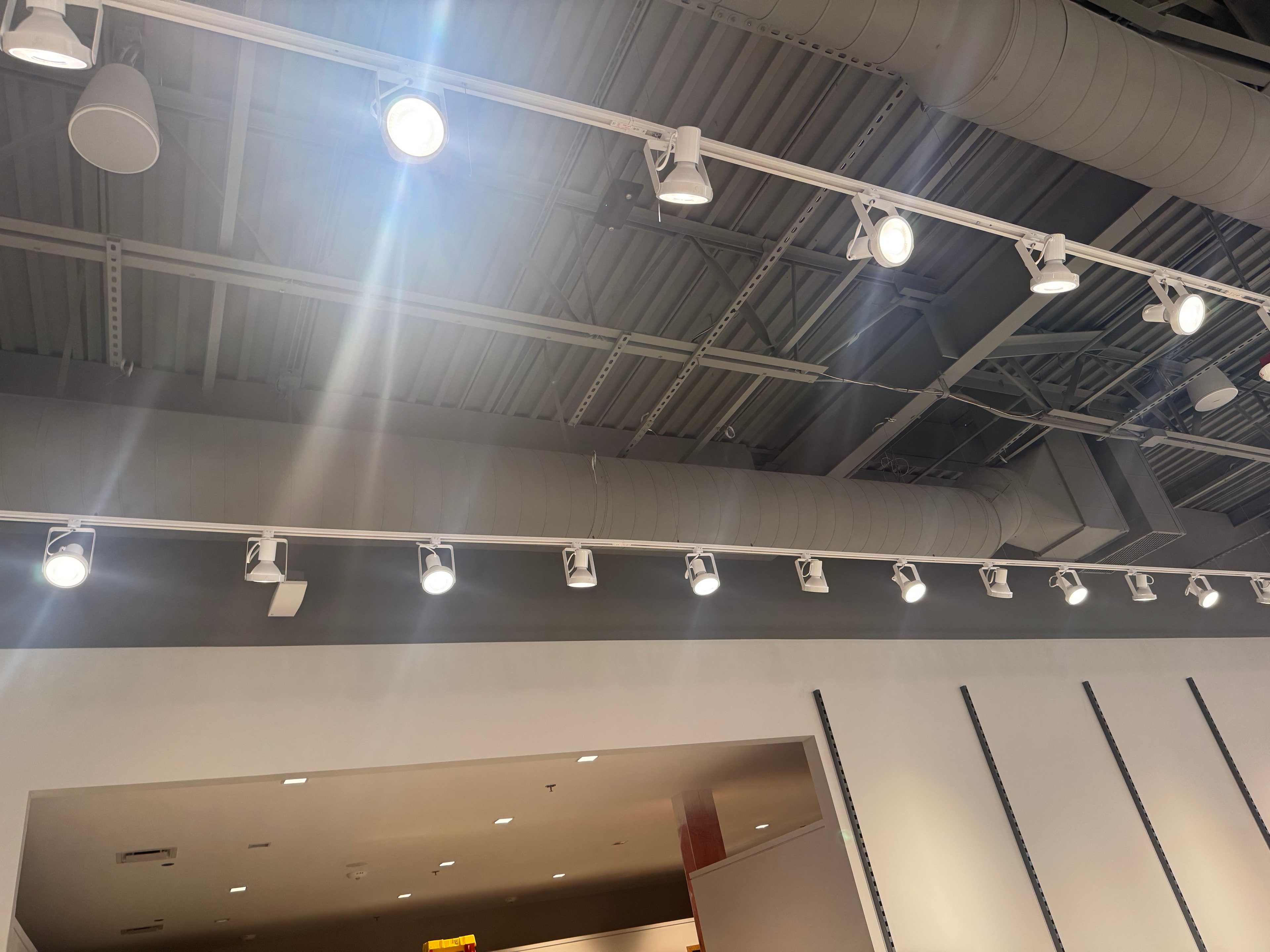 Stockroom — large spiral round main above metal shelving